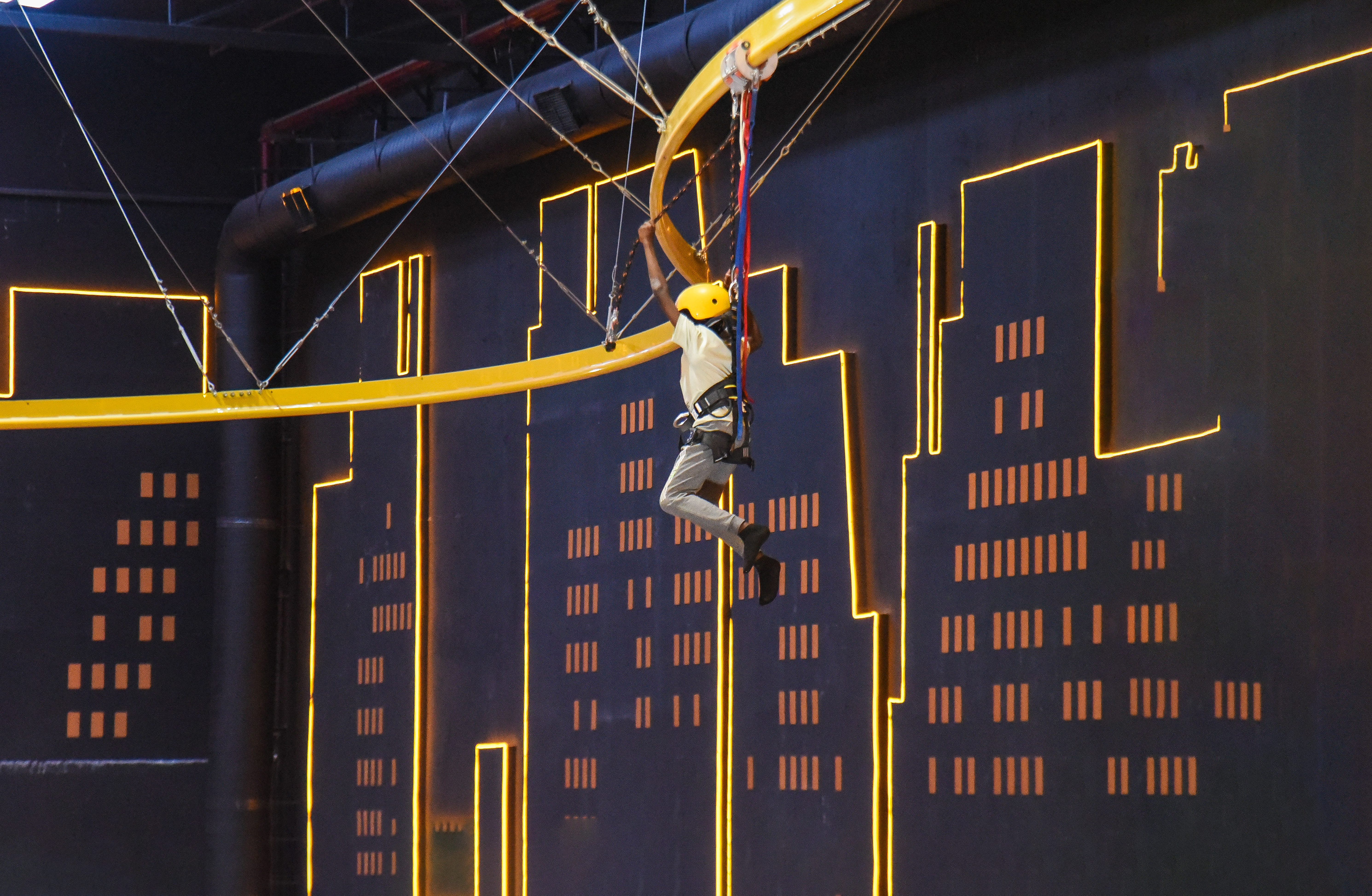 Visitor gliding through the Aerial Glider at The Hub Park, a bounce bounce attraction at Nairobi's funland.
