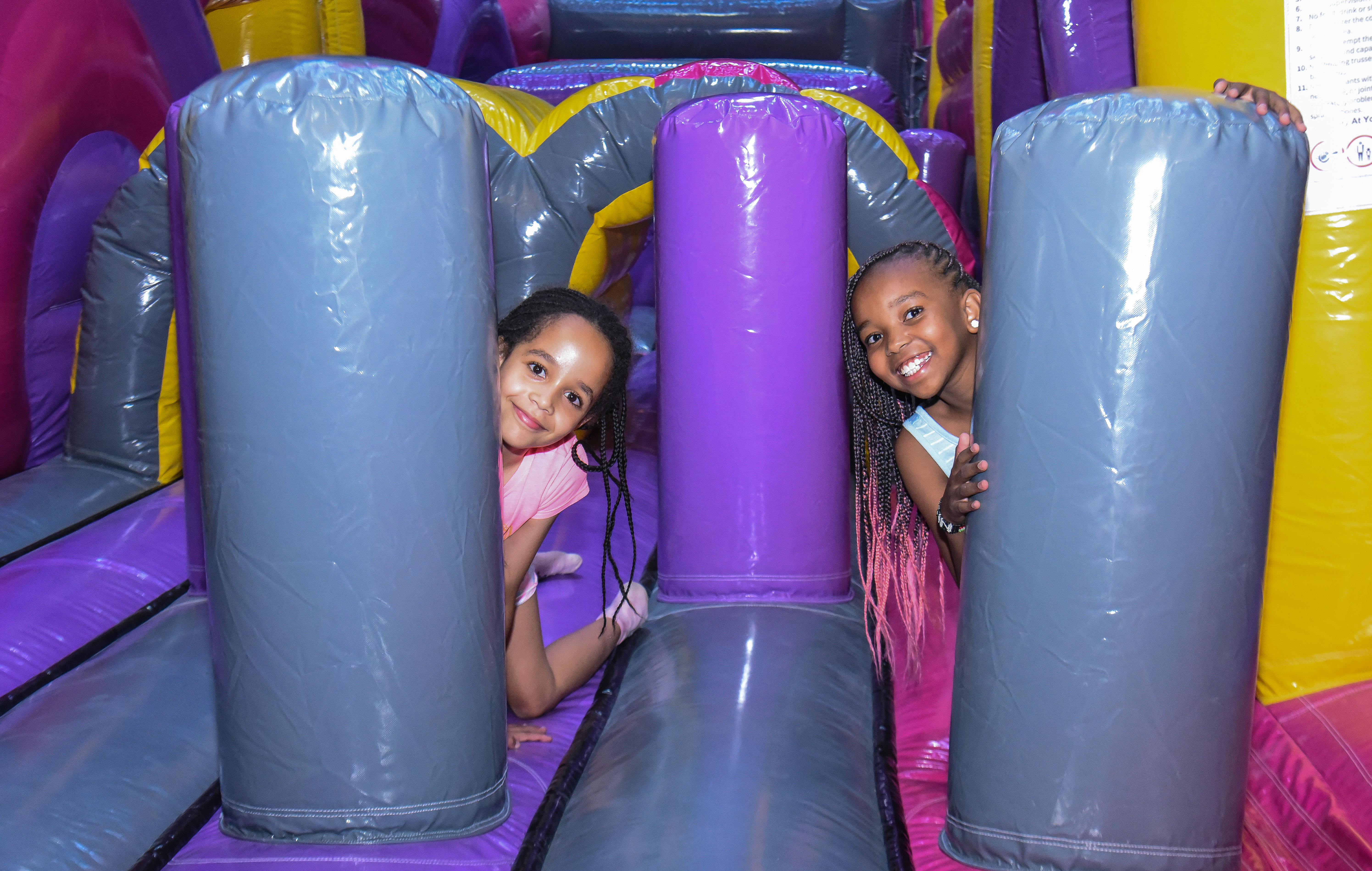 Children enjoying aerial play in the Air Park zone at The Hub Park, an indoor trampoline bounce park near Nairobi.