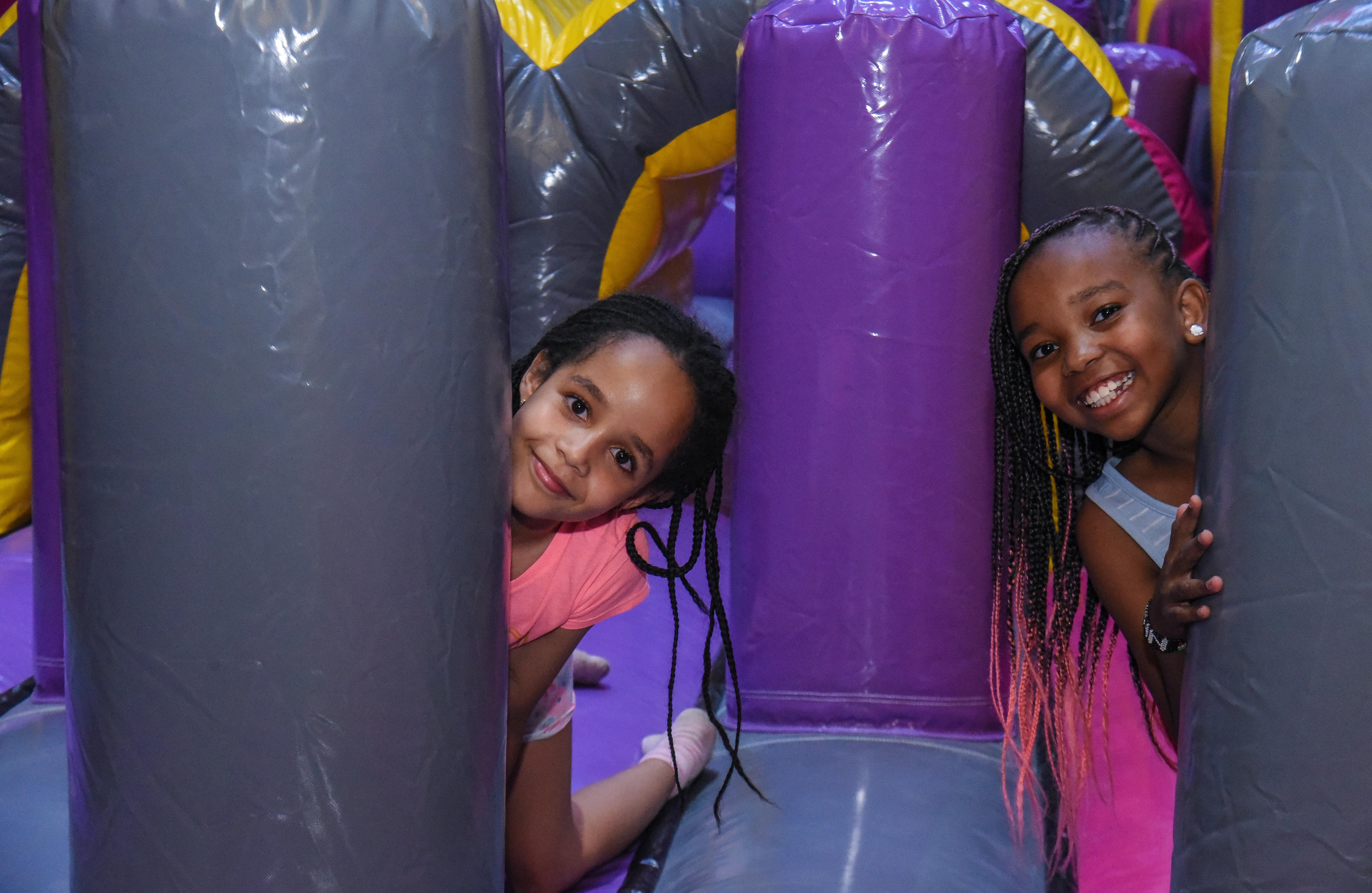 Children enjoying aerial play in the Air Park zone at The Hub Park, an indoor trampoline bounce park near Nairobi.