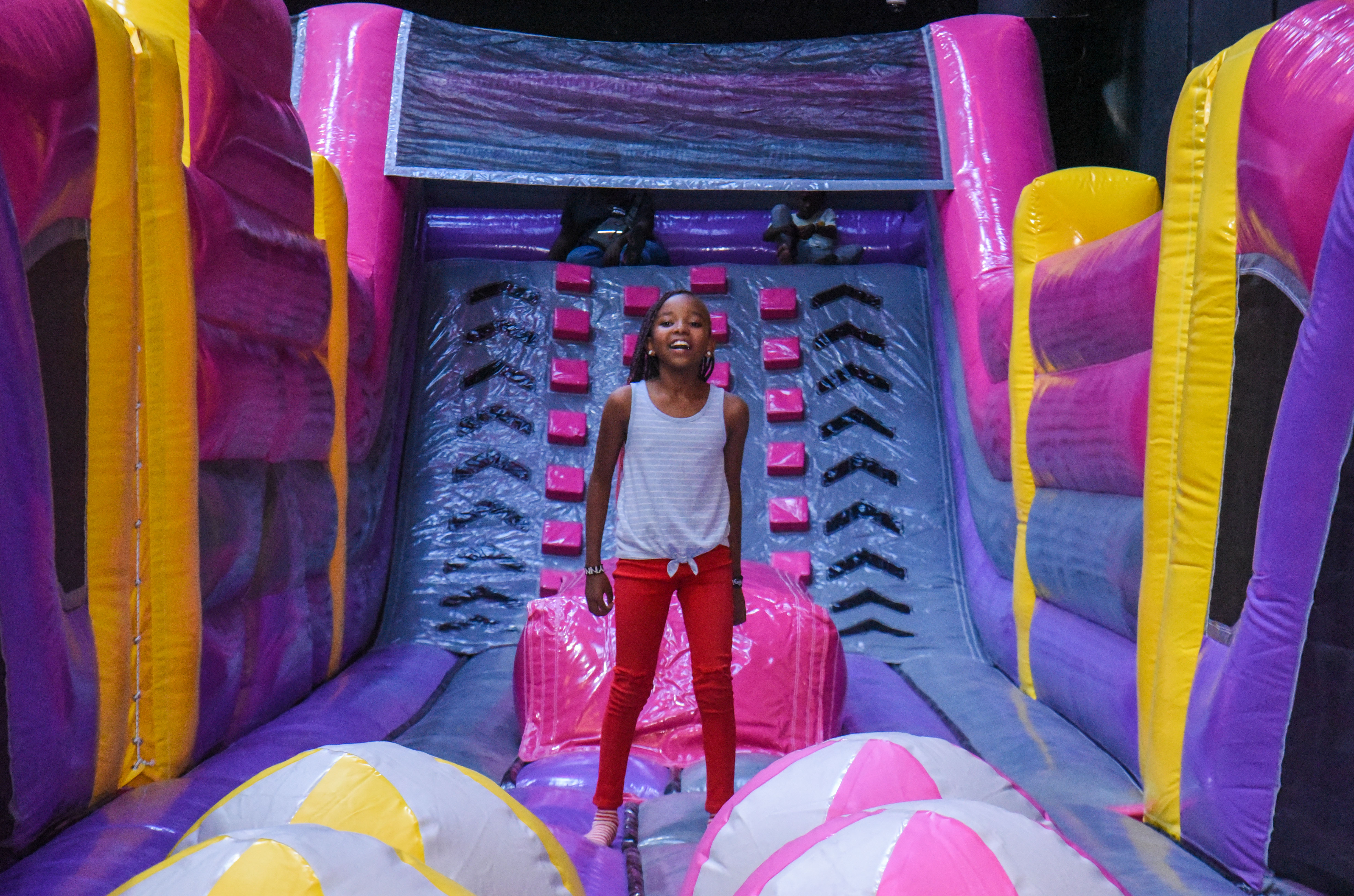 Guest landing on Bag Jump at The Hub Park, a bounce place and game center near me with fun zones for all.