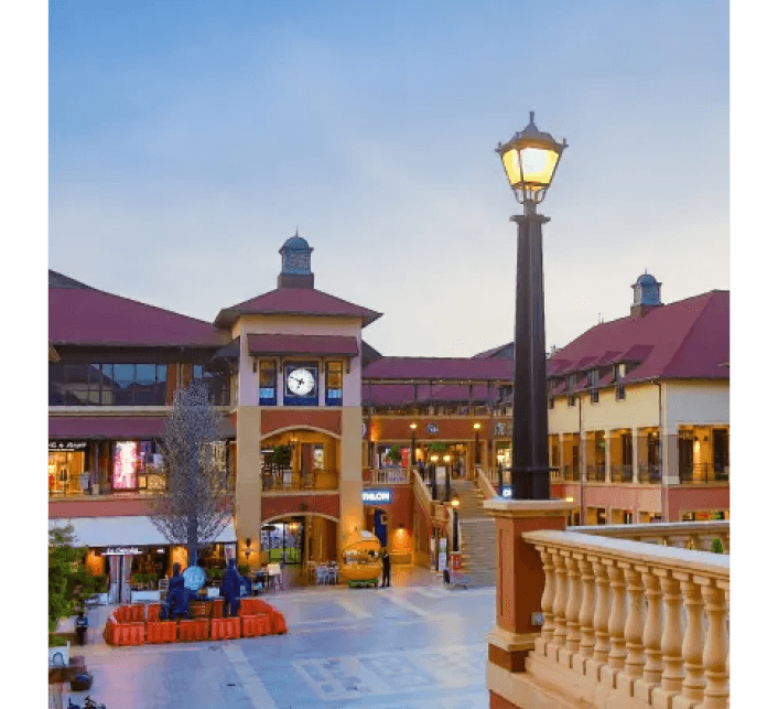 The Hub Karen exterior at dusk, home to The Hub Park, Nairobi's leading indoor funland and bounce trampoline centre.