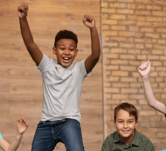 Children excited and jumping during school visit